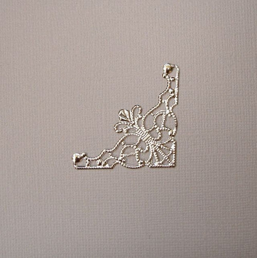 Angle filigrane métal argent